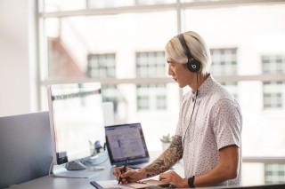 business man working with headphones