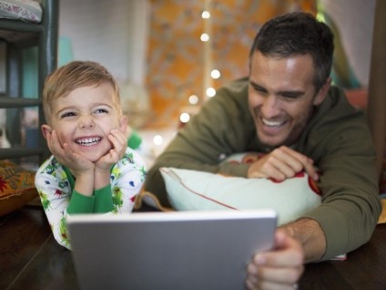Dad and son watching iPad