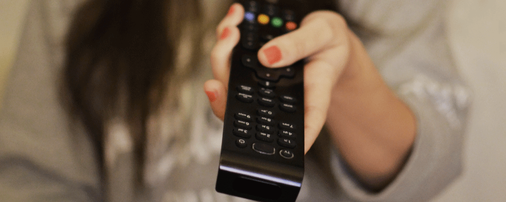 girl pointing remote